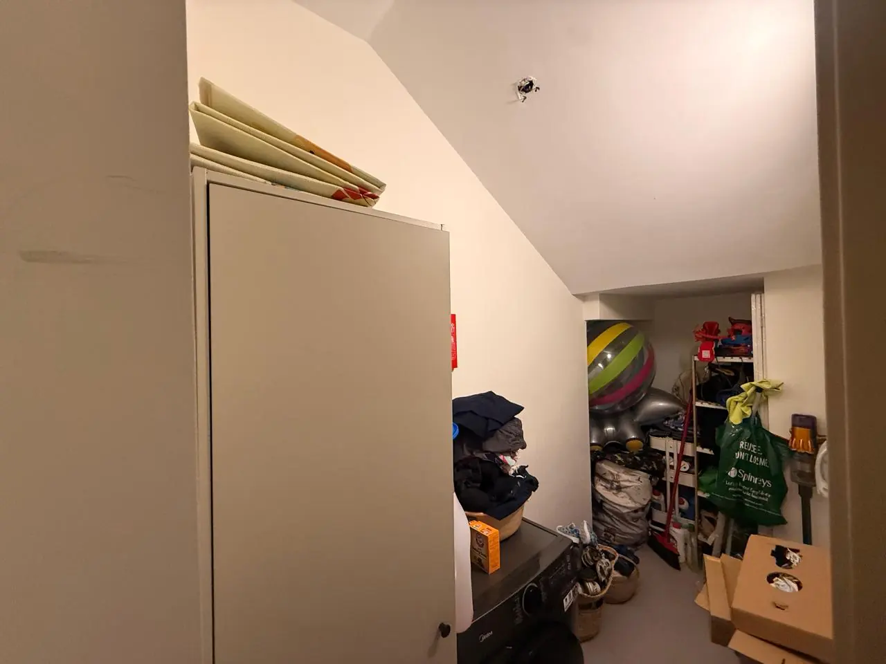 The lived-in townhouse: Photo 10, shot on the agent's phone